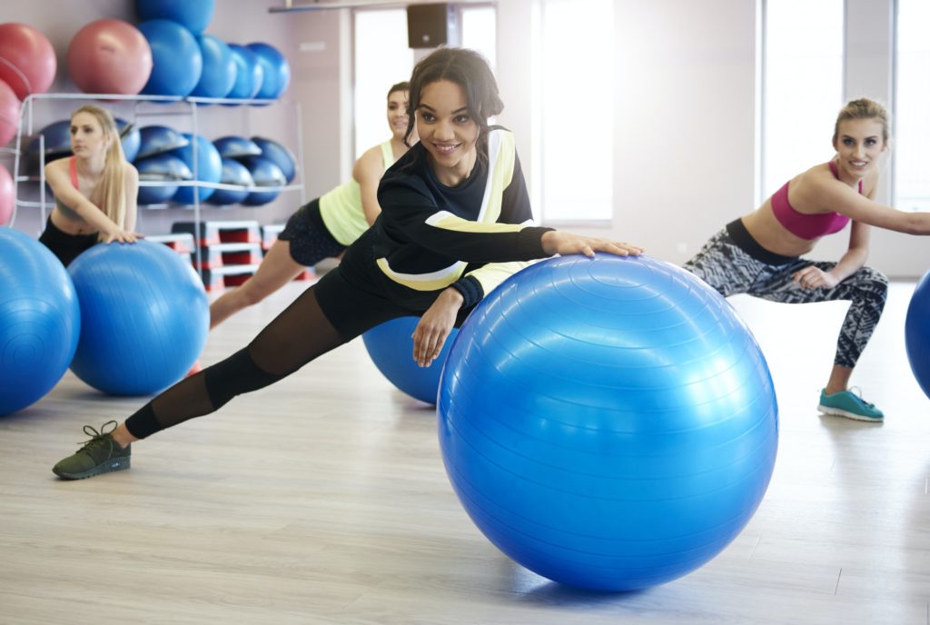 Women exercising with fitness ball